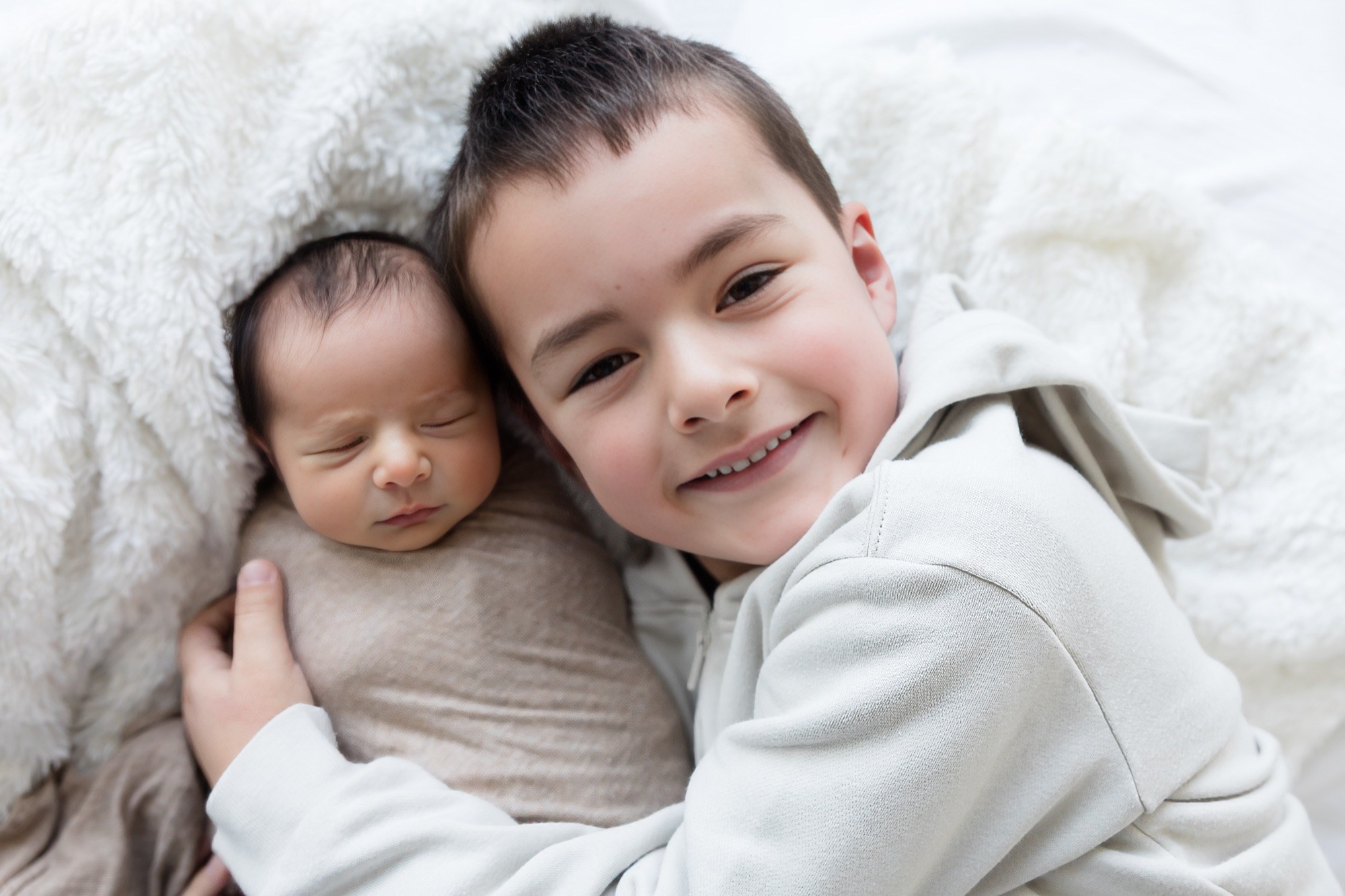 Newborn and parents photographed at The George Centre, Gledswood Hills