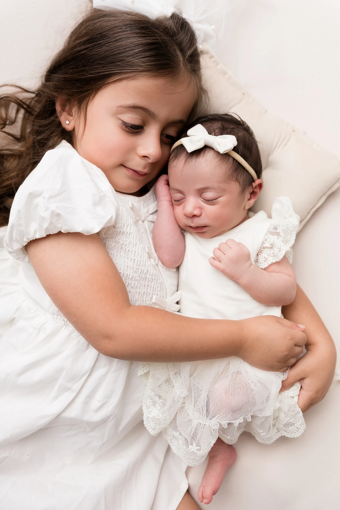 Newborn portrait — soft light, tender posing