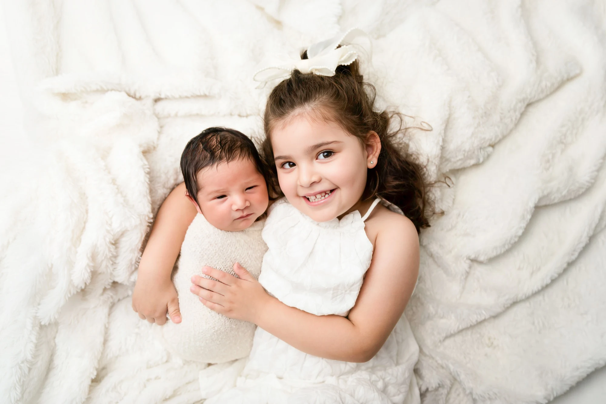 Newborn cradled in wrap